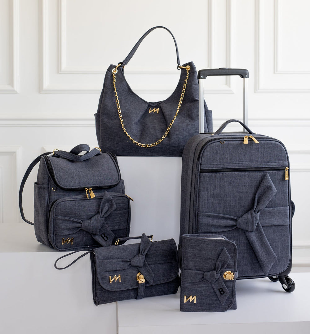 Kit Bolsos Maternidad Nosotros Negro - Maleta con ruedas, Bolso Madeleine, Mochila 2 en 1, Portadocumentos y Cambiador Portátil.